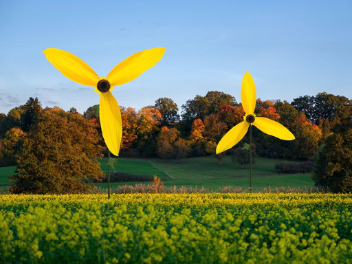 2 mal 3 Blütenblätter symbolisieren 2 Windenergieanlagen in freier Natur